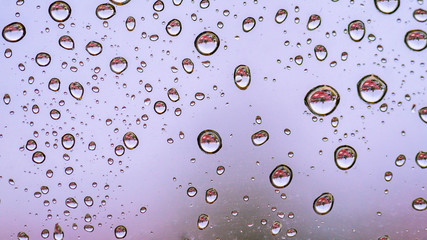 water or rain droplets on glass window. selective focus. narrow depth of field