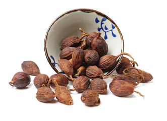 Black cardamom on a white background 