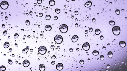 water or rain droplets on glass window. selective focus. narrow depth of field