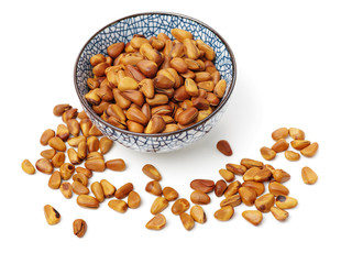 Pine nuts on white background