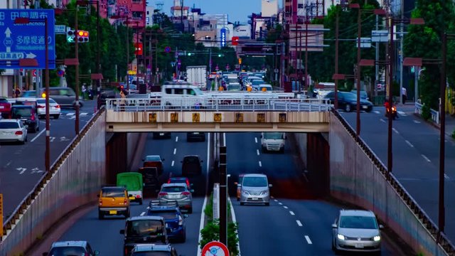 A timelapse of downtown street at Kanpachi avenue in Tokyo daytime long shot panning