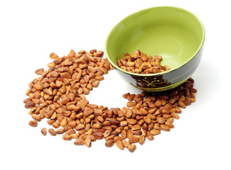 Pine nuts on white background