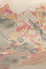 This a photograph of a Pink,White,and Gray abstract marbleized design created using nail polish