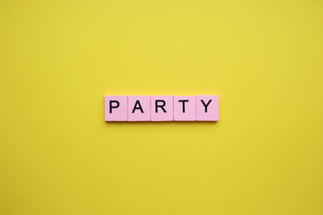 Party word on yellow background holiday concept