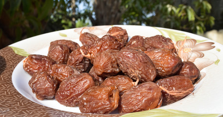 Fresh sweet dates fruit on plate