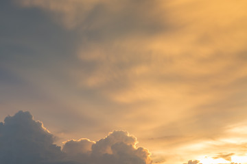 Golden sky and clouds before sunset