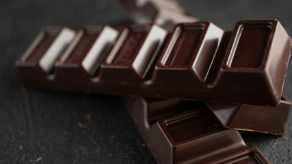 Chocolate bars close-up on concrete.