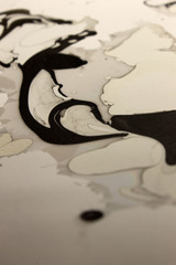 This is a photograph of a Black,Gray and White abstract marbleized background created using nail polish