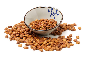 Pine nuts on white background