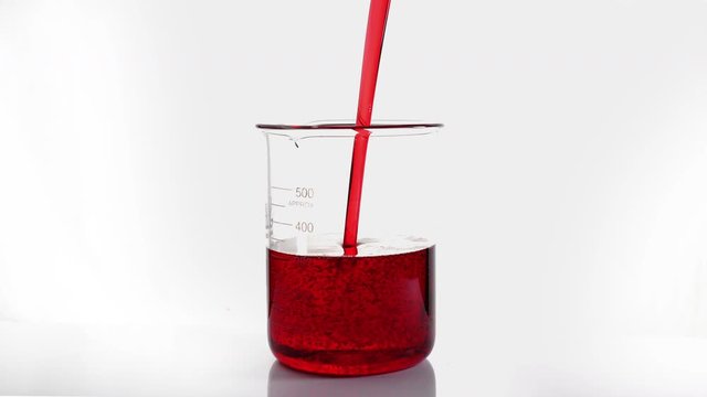 Motor oil pouring on white background