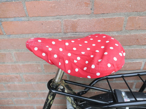 Autumn: Red Saddle With White Dots Like The Mushroom Fly Agaric Or Amanita Muscaria