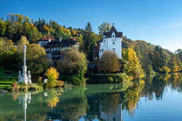 Obraz premium old castel at the river in autumn blue sky