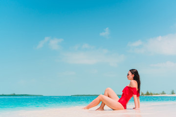 Young fashion woman in swimsuit on the beach