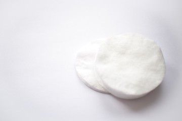 women intimate hygiene products - sanitary pads and tampon on pink background. Moisturizing cream for clean and soft skin in winter time. Heart shape created from cream. Love a body. 