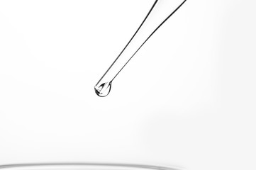 Drop the chemical into the beaker.