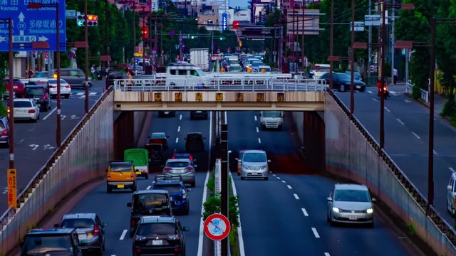 A timelapse of downtown street at Kanpachi avenue in Tokyo daytime long shot zoom