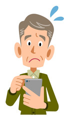 携帯電話を操作するシニアの男性の焦りの表情