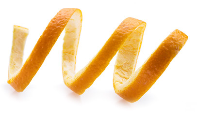 Orange peel or orange twist on white background. Close-up.