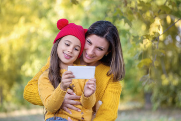 Happy family mother and daughter  taking selfie