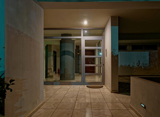 Fototapeta na wymiar modern house entrance door night view, Athens Greece