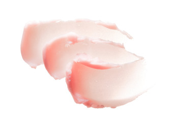 Delicate pink texture and strokes of a cosmetic face mask or cream on a white background
