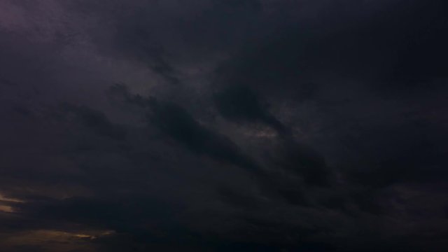 Clouds moving and rolling on twilight to dark sky background. 4k time lapse footage.