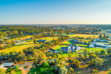 Rural houses and agricultural land at sunset in Moama, NSW, Australia