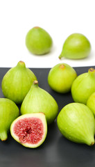 Ripe figs on a white background