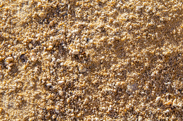 Mound of fine yellow gravel close-up