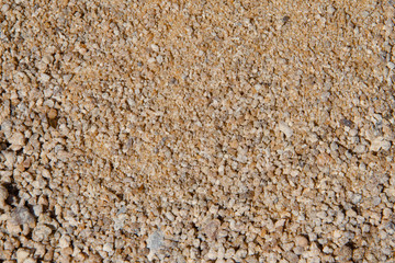 Mound of fine yellow gravel close-up