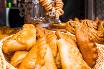 freshly baked pies on the background of the samovar with karlikami. Traditional Russian pie Kournik and Samovar © diy13