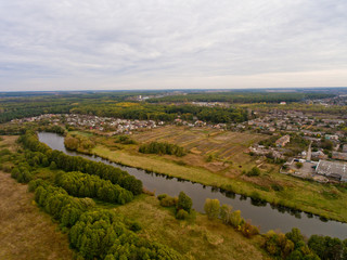 European village, river, forest. Aerial view.