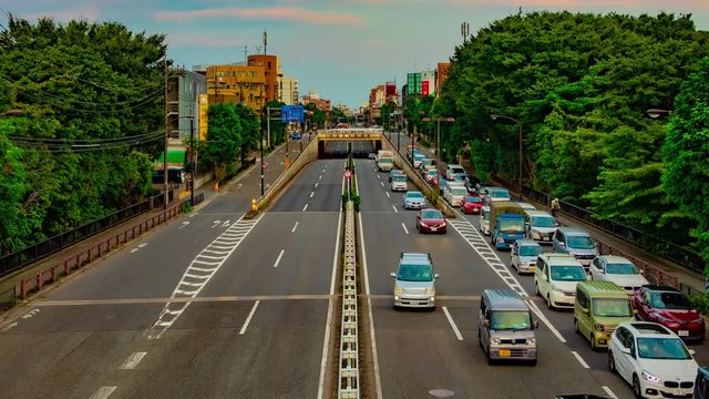 A timelapse of downtown street at Kanpachi avenue in Tokyo daytime wide shot panning