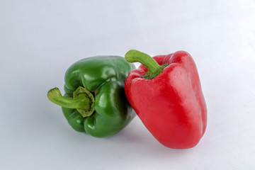 Organic green and red Bellpepper isolated on white background