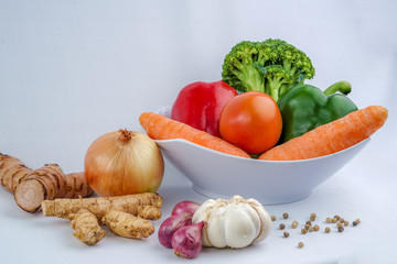 Fresh spices and vegetable isolated on white background