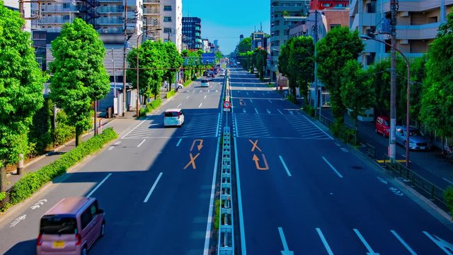 A timelapse of downtown street at Kanpachi avenue in Tokyo daytime wide shot panning