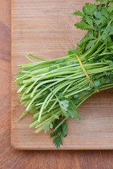 fresh parsley on a wooden board