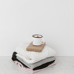 Hot drink and present on warm clothes