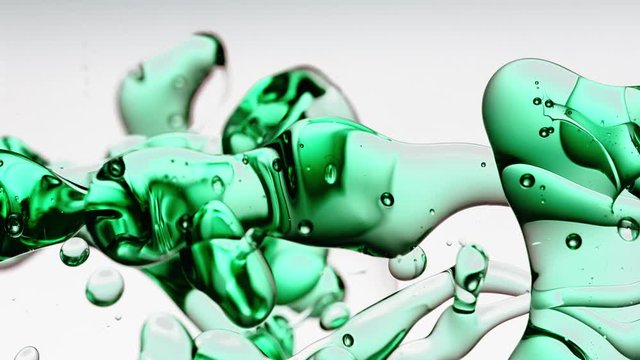 transparent petrol, green blue oil bubbles and fluid shapes in purified water on a white gradient background. Side angle with crystal colored bubbles in purified water cosmetic backdrop with copy spac