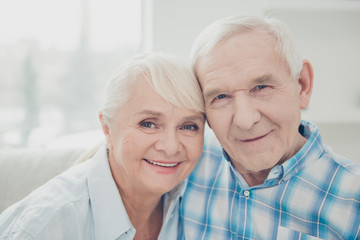 Photo of two pretty aged people pair leaning heads family portrait comfortable flat indoors