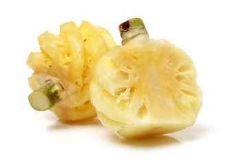 Ripe pineapple peeled on white background