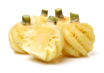 Ripe pineapple peeled on white background