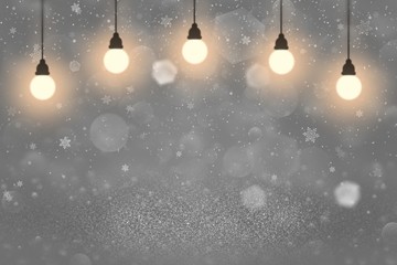 Fototapeta na wymiar cute shiny glitter lights defocused bokeh abstract background with light bulbs and falling snow flakes fly, celebratory mockup texture with blank space for your content
