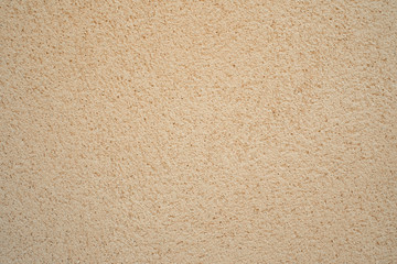 The texture of the sand block of cream color, wall background