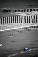 plastic tin hanging on the beach