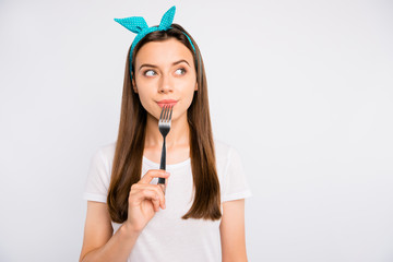 Hmm what eat. Portrait of thoughtful girl hold fork think have thoughts about decide decision...