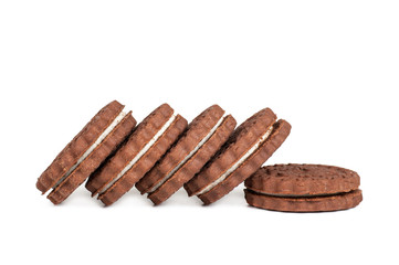 brown chocolate round cookies in a stack isolated on white background