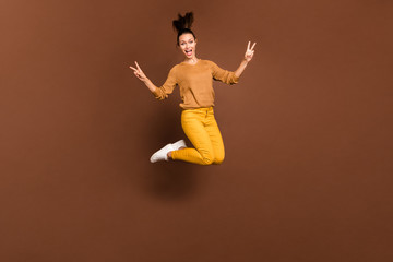 Fototapeta na wymiar Full length body size photo of charming cheerful fascinating cute nice pretty girl showing you double v-sign jumping up rejoicing with shop discounted isolated brown pastel color background