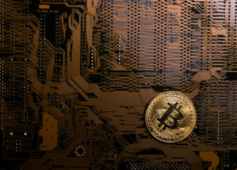 Bitcoins on circuit boards. financial concepts.