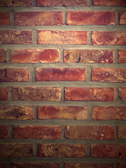 Fototapeta premium Light shining on interior brick wall